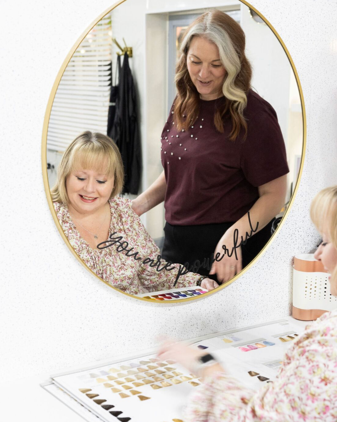 Claire working one-to-one with a client in her boutique salon