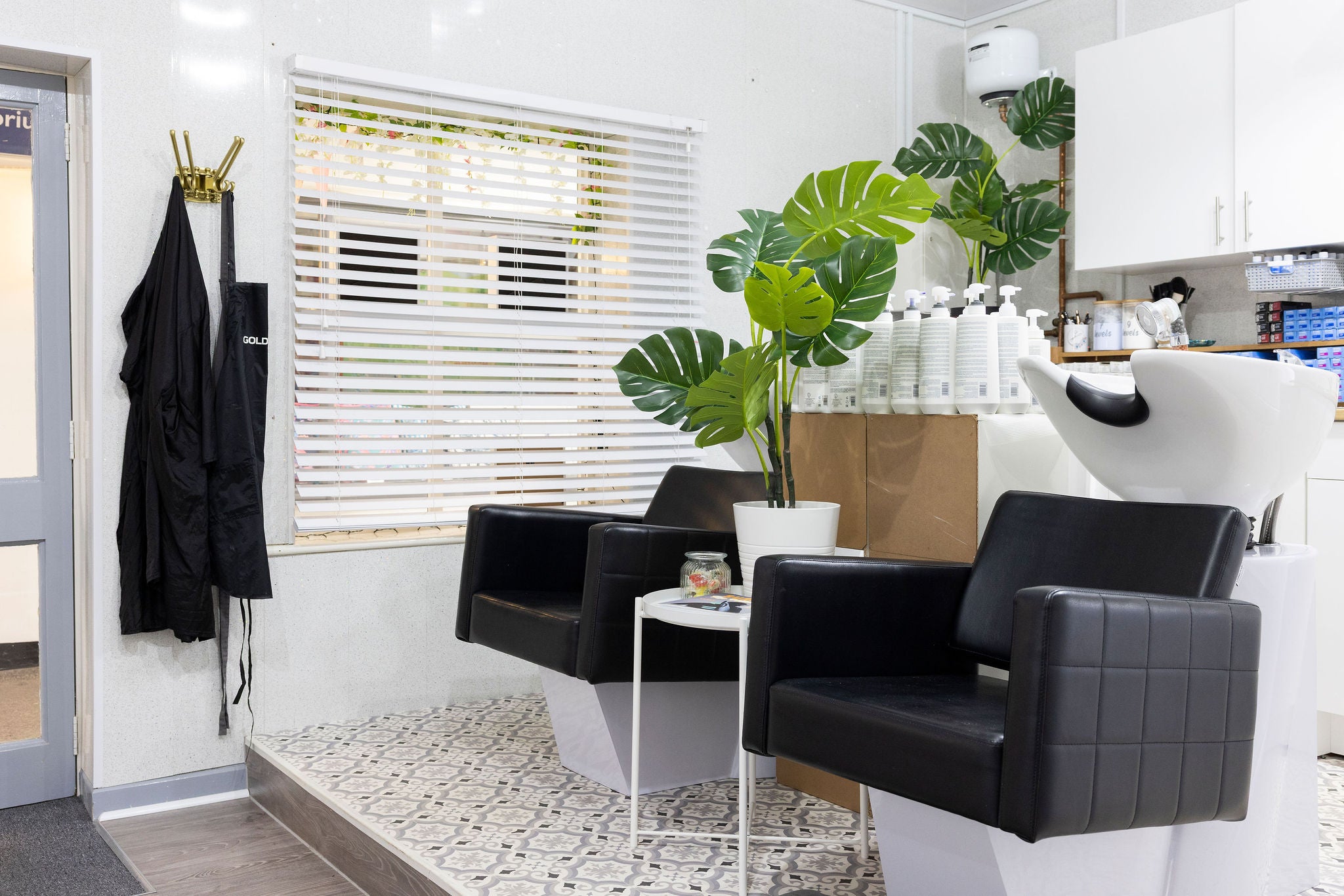 Bright, welcoming salon space with multiple styling stations at C.E Hair